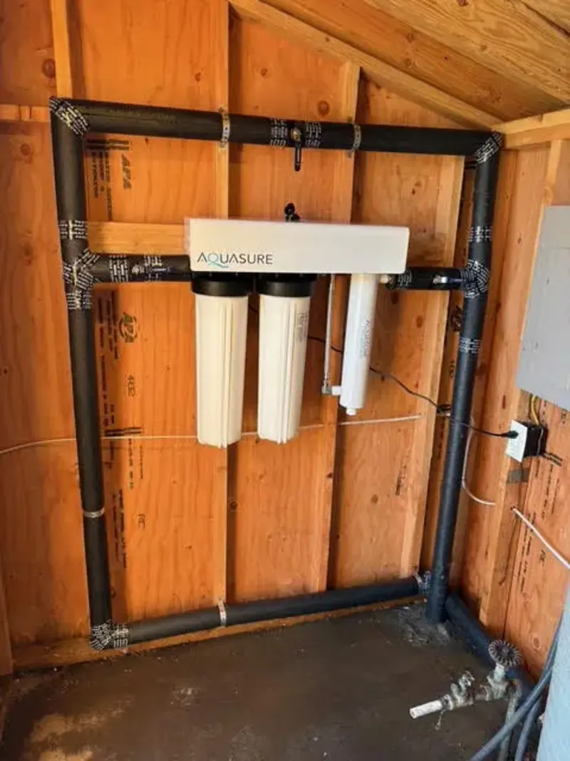 A whole-house water filtration system installed by Wild Pine Plumbing